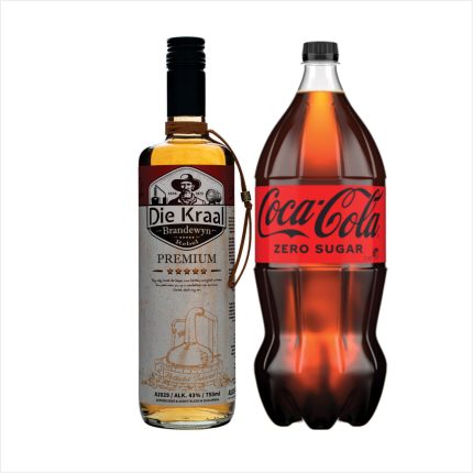 A bottle of Die Kraal premium brandy next to a Coca-Cola Zero Sugar bottle.